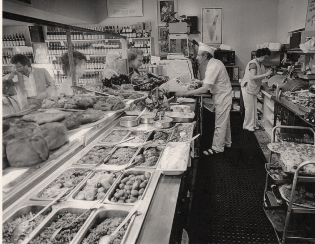 Black and white archival photo of a deli counter